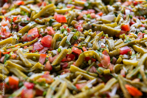 Fresh chopped Nopales Salad with tomatoes and onions 