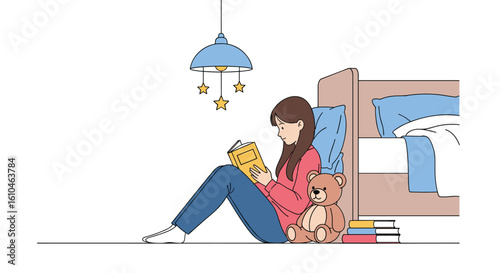 Young person enjoys reading a book while sitting on the floor next to a cozy bed with a small toy nearby