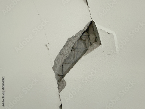 Cement wall crack and break at ceiling to wall from earthquake