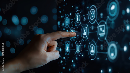 A hand is pointing at a screen with a lot of icons and a blue background