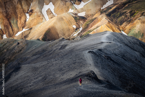 A man is trekking in landmannalaugar (Highland) of Iceland with dramatic cloud