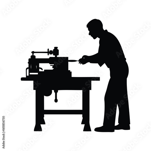 Silhouette of a man using a woodworking lathe to shape wood
