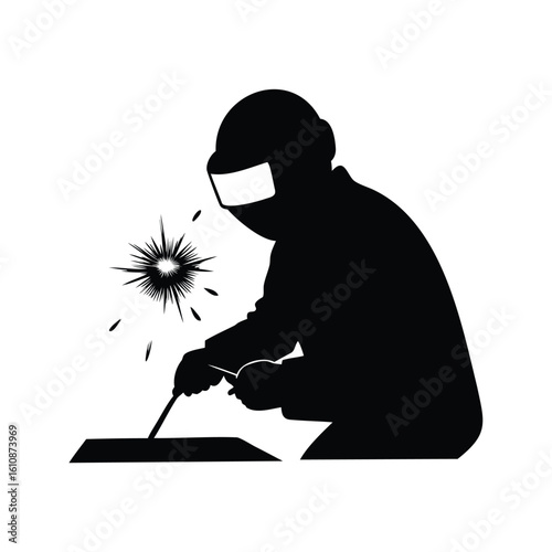 Silhouette of a welder in protective gear working with welding equipment