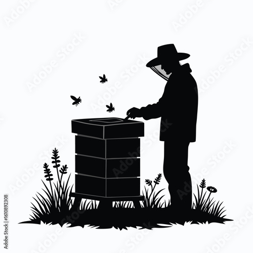 Beekeeper tending to hive with bees and grass apiary beekeeping