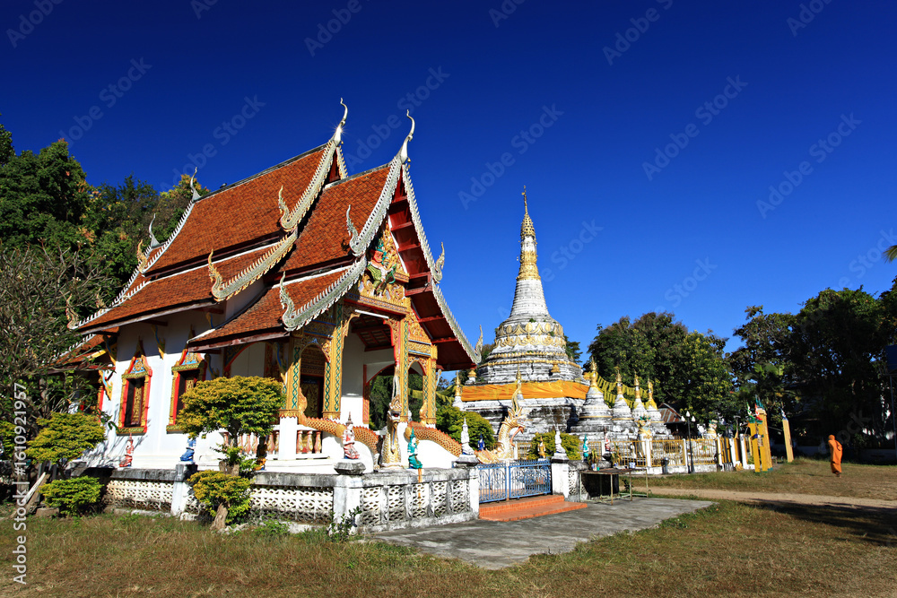 Naklejka premium Scenery of Buddhist temple and white pagoda in Wat Luang (Luang Temple) in Pai District, Mae Hong Son Province, Thailand