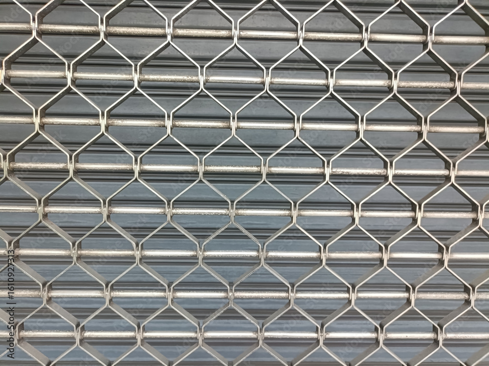 Naklejka premium Metal security gate feels protective, solid, and secure, providing protection, and closure in front of store or building