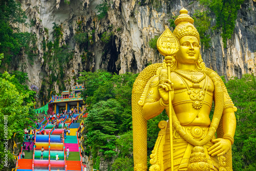Photography View of Batu Caves with the colorful steps and the Hindu statue located in the north of Kuala Lumpur, Malaysia