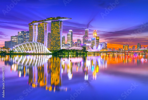 Photography View of the skyline at the Downtown Core along Marina Bay at dusk in Singapore