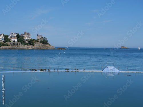Dinard outdoor swimming pool with islands and a castle in the background