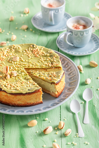 Sweet pistachio cheesecake served with bue coffee.