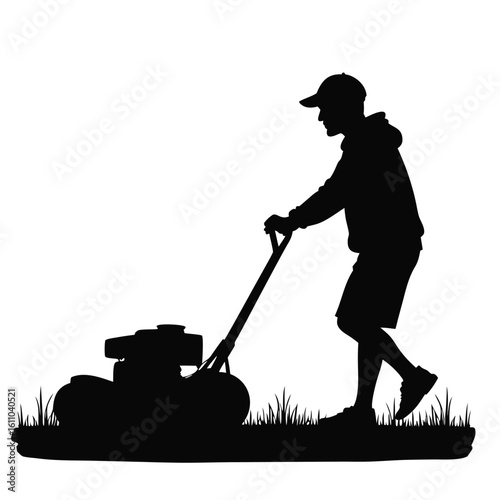 Silhouette of person mowing grass lawn