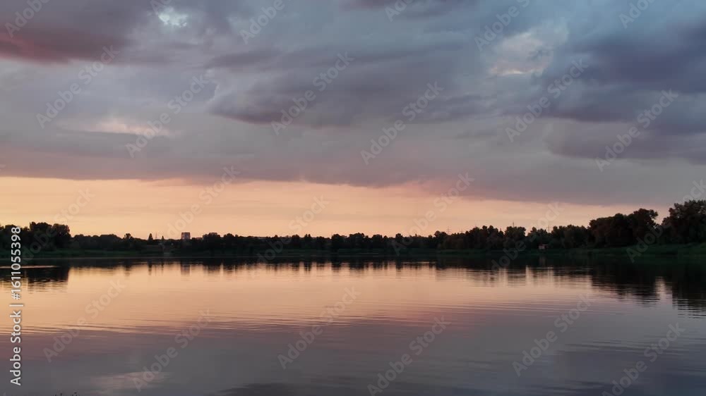 very beautiful sunset with water. summer evening landscape with reflection of clouds in water. setting sun on horizon. summer landscape with lake. reflection of trees in water. sunrise on river very beautiful sunset with water. summer evening landscape with reflection of clouds in water. setting sun on horizon. summer landscape with lake. reflection of trees in water. sunrise on river