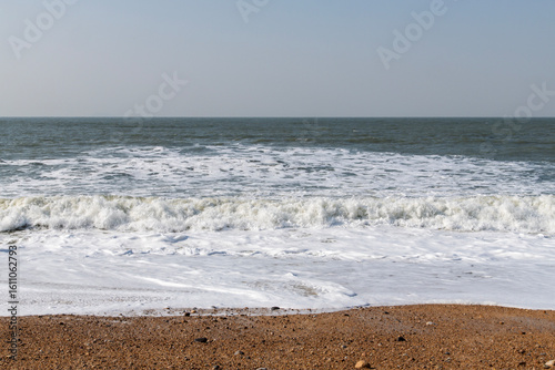 Fototapeta Naklejka Na Ścianę i Meble -  tranquil seascape with breaking waves on the beach in winter