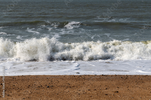 Fototapeta Naklejka Na Ścianę i Meble -  tranquil seascape with breaking waves on the beach in winter