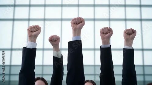 Hands Raised in Unity Against Modern Corporate Background
