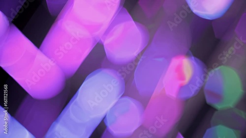 Abstract purple and pink bokeh lights moving in soft motion, dreamy visual loop ideal for festive atmosphere or creative background