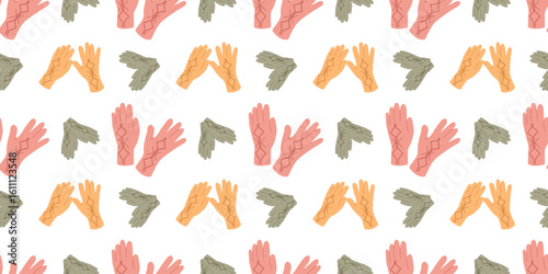 Warm fall apparel seamless pattern with gloves in flat style. Autumn vector illustration for creative design needs