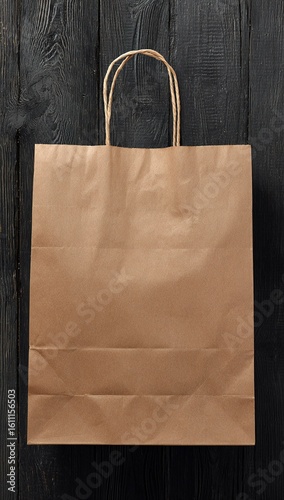 Kraft shopping bag on dark wooden wall

