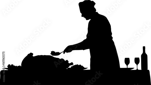 Silhouette of a chef serving food from a large dish with wine glasses and a bottle on the table near by
