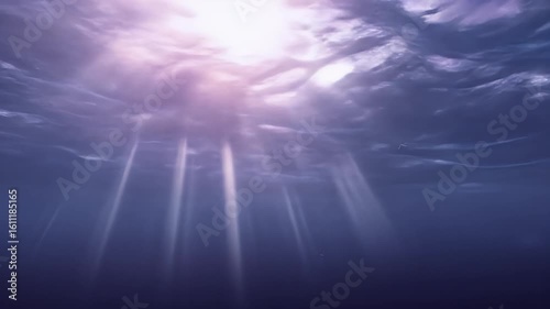 Submerged Underwater Scene with Beams of Sunlight Piercing Through Purple and Blue Water Depths: A Peaceful and Serene Aquatic Seascape