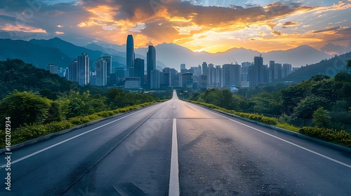 Road leading to modern city skyline at sunset