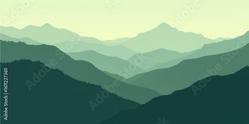 Sunrise over misty mountain peaks
