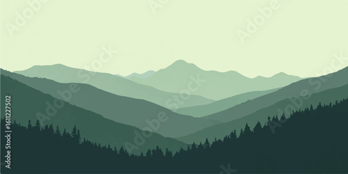 Mountain landscape with clouds, misty hills, and forested valleys in the mountains