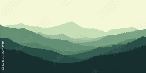 Sunrise over misty mountain peaks