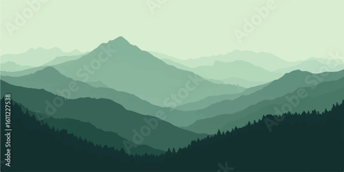 Morning mist settles in a peaceful valley with a forest of trees and distant mountain peaks at sunrise