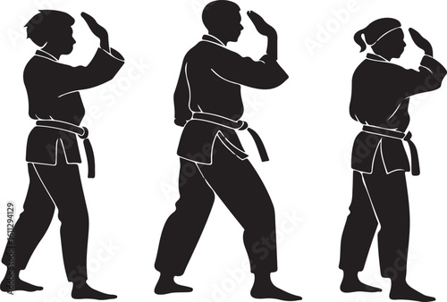 Silhouettes of karate practitioners executing a defensive hand technique and stance