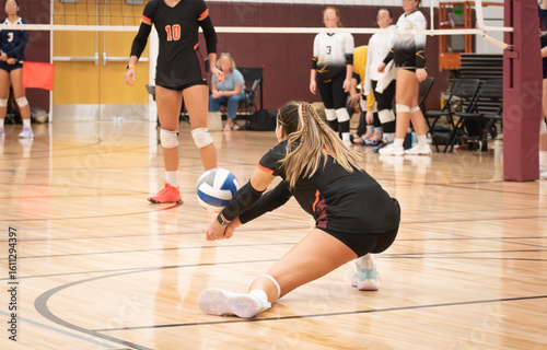 College volleyball player passing the ball with perfect form