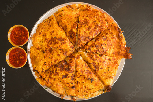 Birria pizza with broth