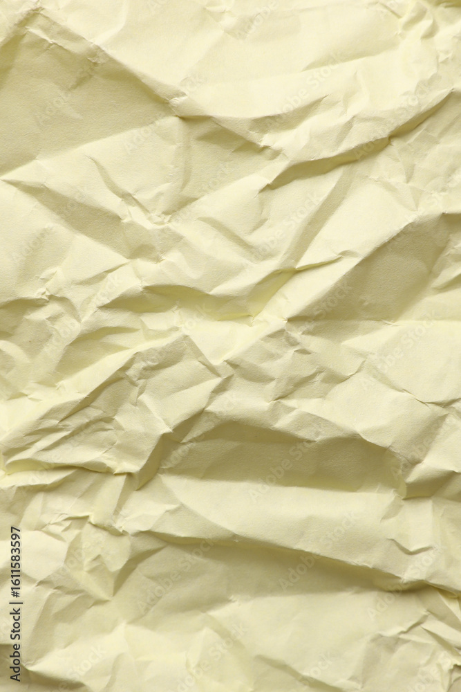 Fototapeta premium Crumpled yellow paper background texture