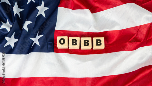 The One Big Beautiful Bill Act text Flag of the United States of America background.
Tax Cuts and Jobs Act. 
State and Local Taxes. obbb