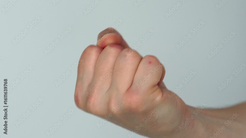 Male fist and gesture of aggression.
Man provokes aggressive behavior.
Fisting with hand on white background.
Man imitates punching with fist.
Domestic violence and conflicts in family Male fist and gesture of aggression.
Man provokes aggressive behavior.
Fisting with hand on white background.
Man imitates punching with fist.
Domestic violence and conflicts in family