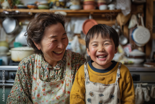 Grandmother and grandson cooking in rustic kitchen.