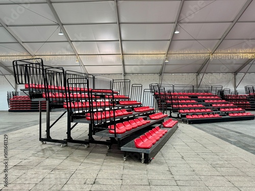 Polymer Retractable Telescopic Seating or Bleachers in a warehouse, unfolded side view.