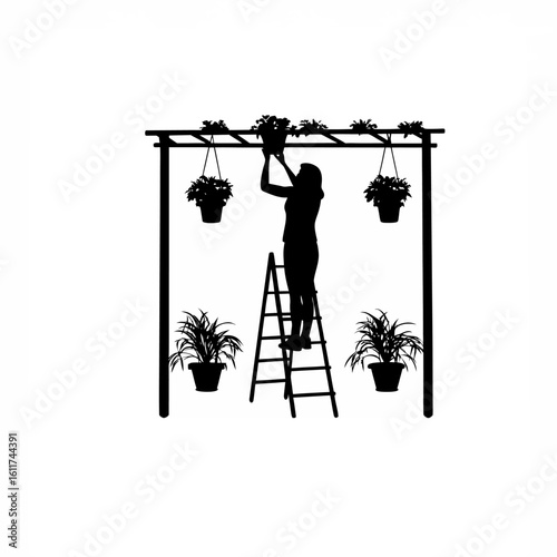 Silhouette of a woman trimming plants in hanging pots