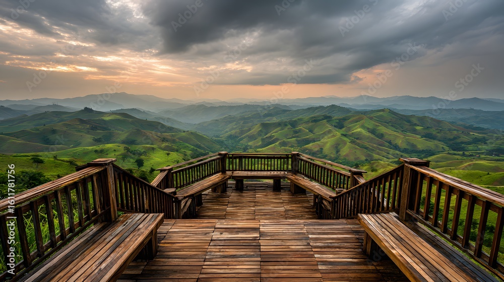 Fototapeta premium Wooden observation deck overlooking a vast valley of rolling hills.