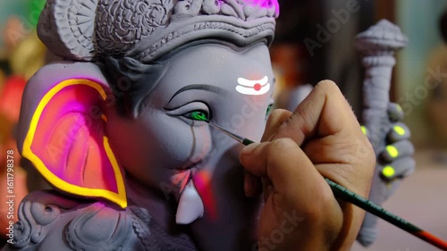Artist paints an Idol of Lord 