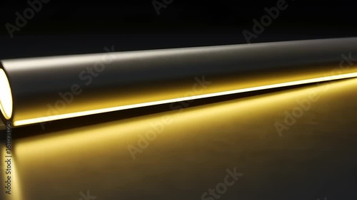 Sleek modern LED light fixture casting a warm glow on a smooth surface in a dark setting
