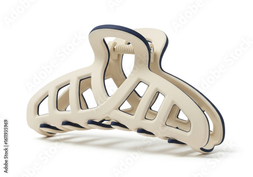 A beige and blue claw hair clip isolated on white background