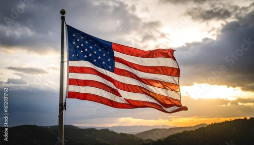 American flag at sunset over mountains