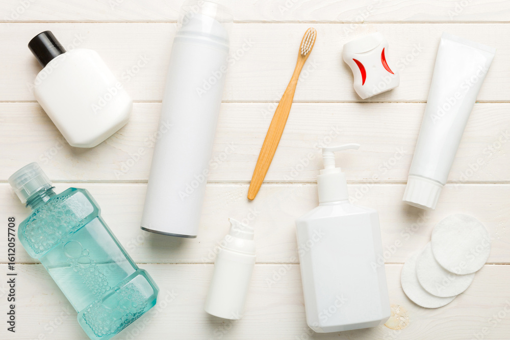 Naklejka premium Mockup for bathing products top view flat lay, spa razor, toothpaste, soap, gel and other various accessories. Cosmetics for skin health. Bath Mockup for your logo