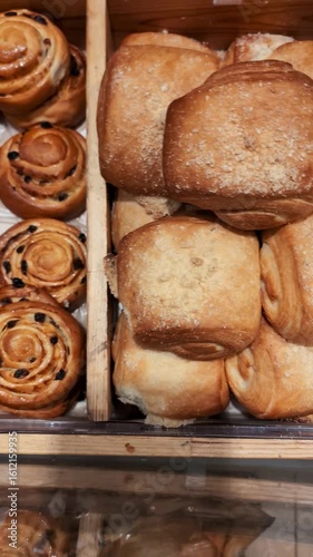 Freshly baked pastries displayed at a local bakery inviting customers to indulge in sweet treats and enjoy a cozy atmosphere