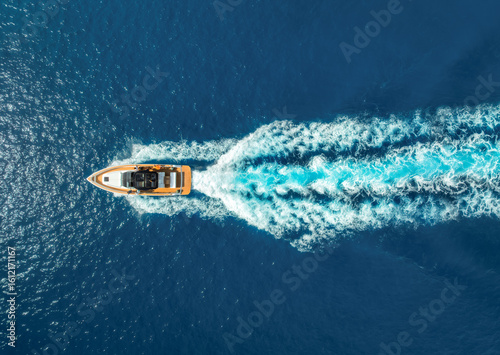 Wallpaper Mural Aerial view of speed boat in crystal clear turquoise water at sunset. Summer in Mallorca, Balearic Islands, Spain, Top drone view of luxury yacht, blue sea in sunny day. Tropical landscape. Travel Torontodigital.ca