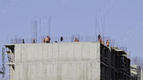 Construction workers building a concrete structure