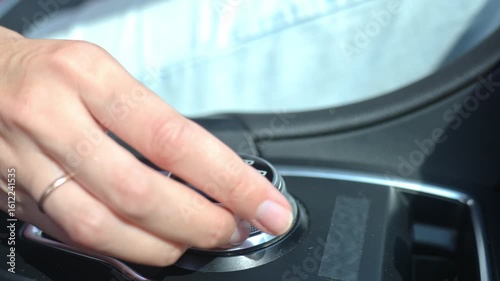 Wallpaper Mural Close-up of hand turning gear shift knob in modern car interior. Driver switches transmission in parking mode on automatic gearbox Torontodigital.ca