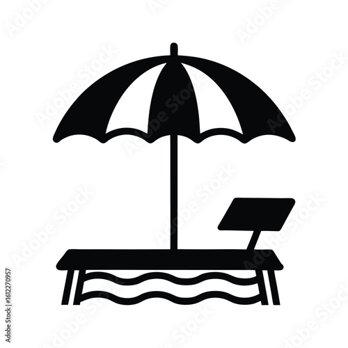 Beach lounger and umbrella silhouette on waves