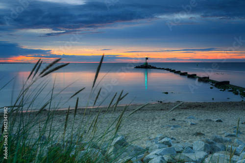 Fototapeta Naklejka Na Ścianę i Meble -  Sunset over the Baltic Sea beach in Gorki Zachodnie, Gdansk. Poland